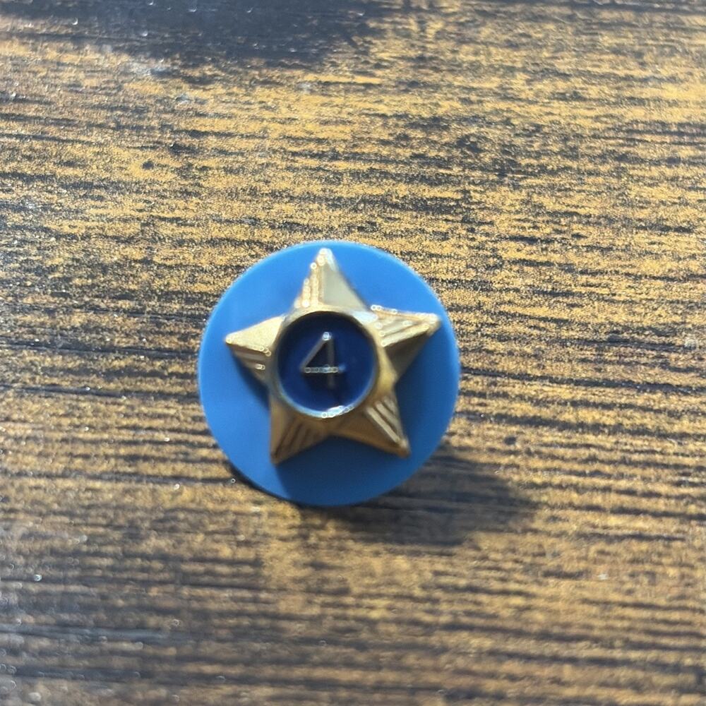 Boy Scouts of America 4 year pin with backer